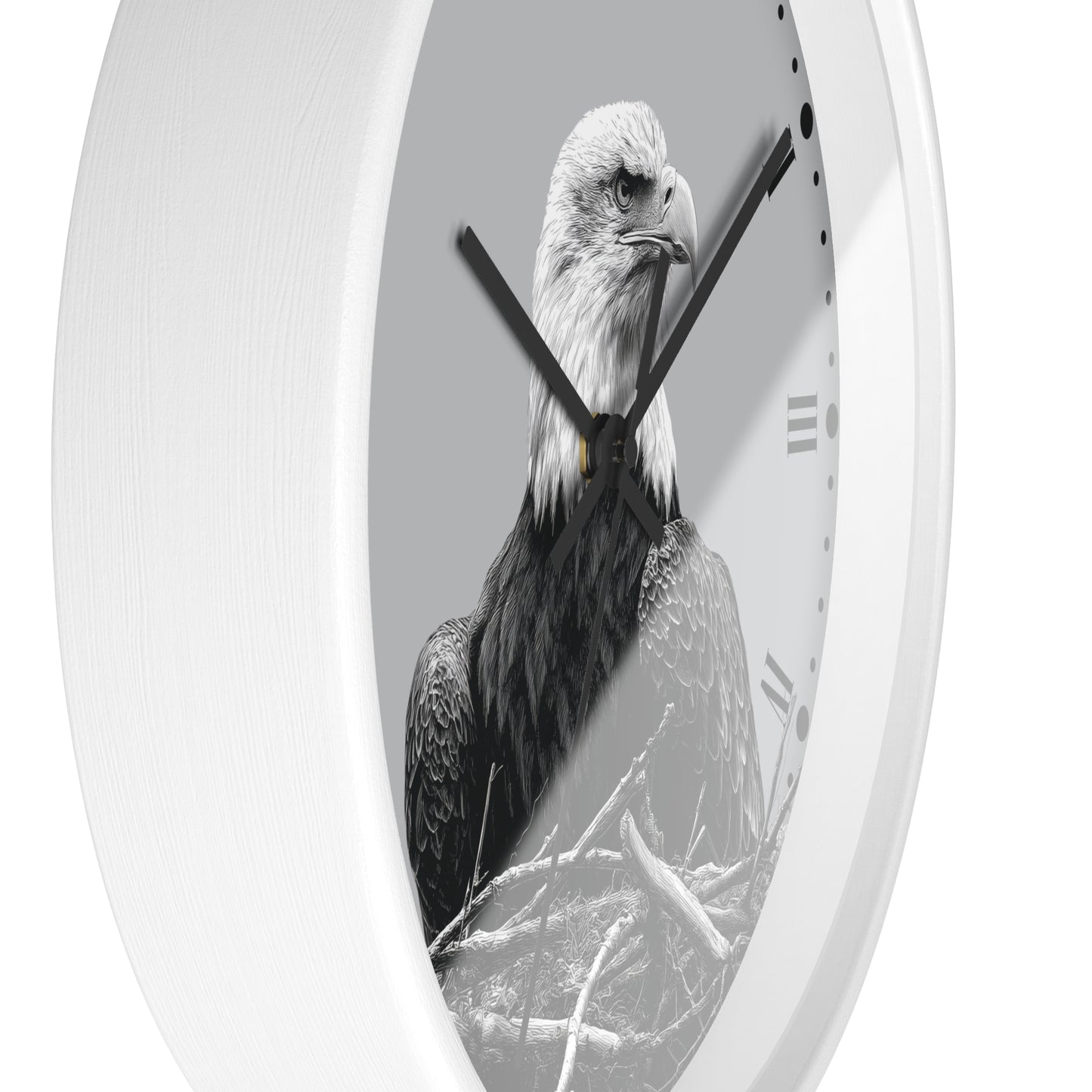 A white oval wall clock featuring a black and white photograph of a bald eagle on the clock face, with black hands and Roman numeral hour markers.