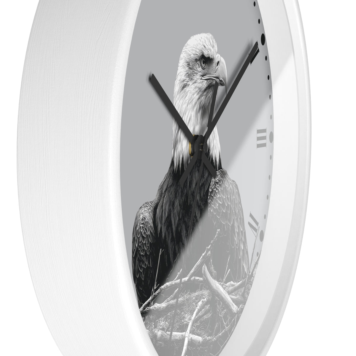 A white oval wall clock featuring a black and white photograph of a bald eagle on the clock face, with black hands and Roman numeral hour markers.