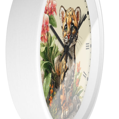 A round wall clock with a white frame and a detailed illustration of a spotted cat cub surrounded by pink flowers and green leaves on the face.