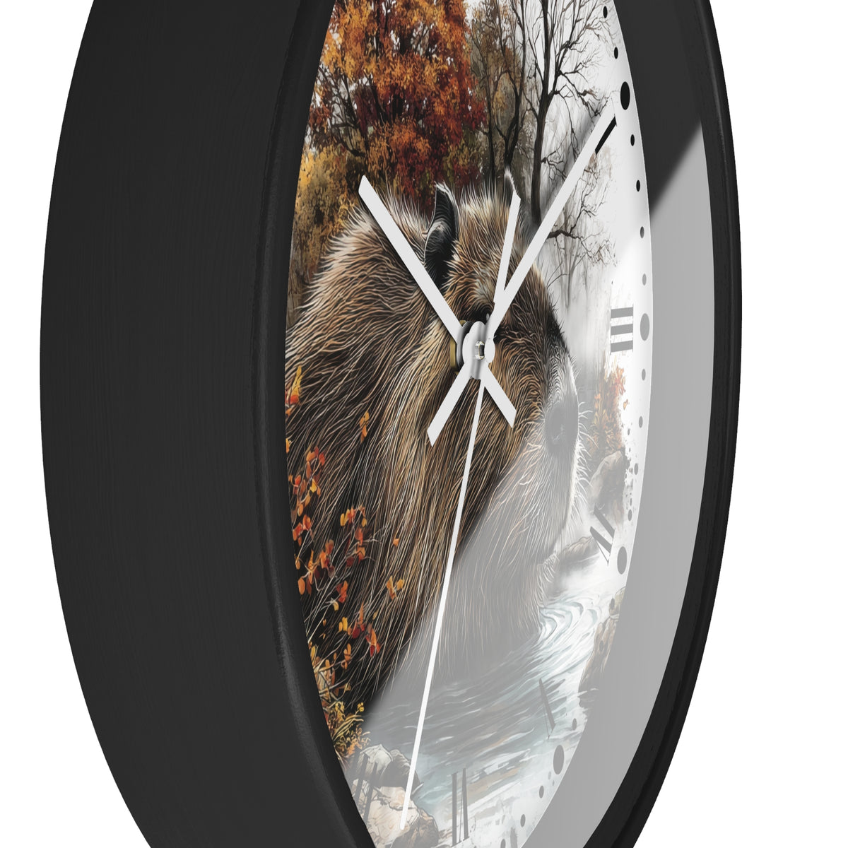 A round wall clock with a black frame and a printed nature scene featuring a capybara, autumn trees, and water. The clock has white hands and black Roman numeral hour markers on a white face, shown against a plain white background.