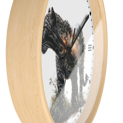 Round wall clock with a light natural wood frame and a white face featuring a photographic print of a leopard with a tree overlay, black hands, and minimalist black numerals.