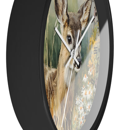 Round wall clock with a black frame and a printed deer in a field design on the face, shown against a plain white background.