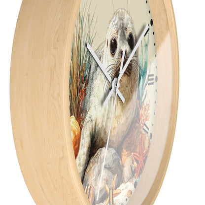 Round wall clock with a light natural wood frame and a printed illustration of a seal on the face, shown against a plain white background.