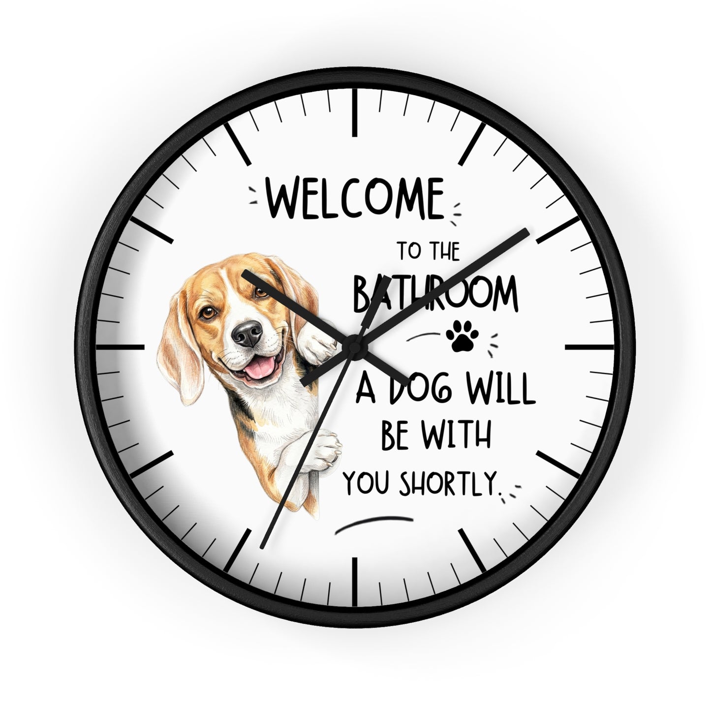A round wall clock with a black frame and white face, featuring a beagle illustration and the text 'WELCOME TO THE BATHROOM A DOG WILL BE WITH YOU SHORTLY.' on a light gray background.