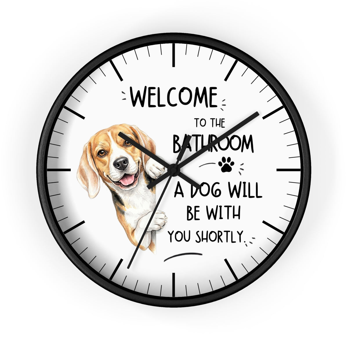 A round wall clock with a black frame and white face, featuring a beagle illustration and the text 'WELCOME TO THE BATHROOM A DOG WILL BE WITH YOU SHORTLY.' on a light gray background.