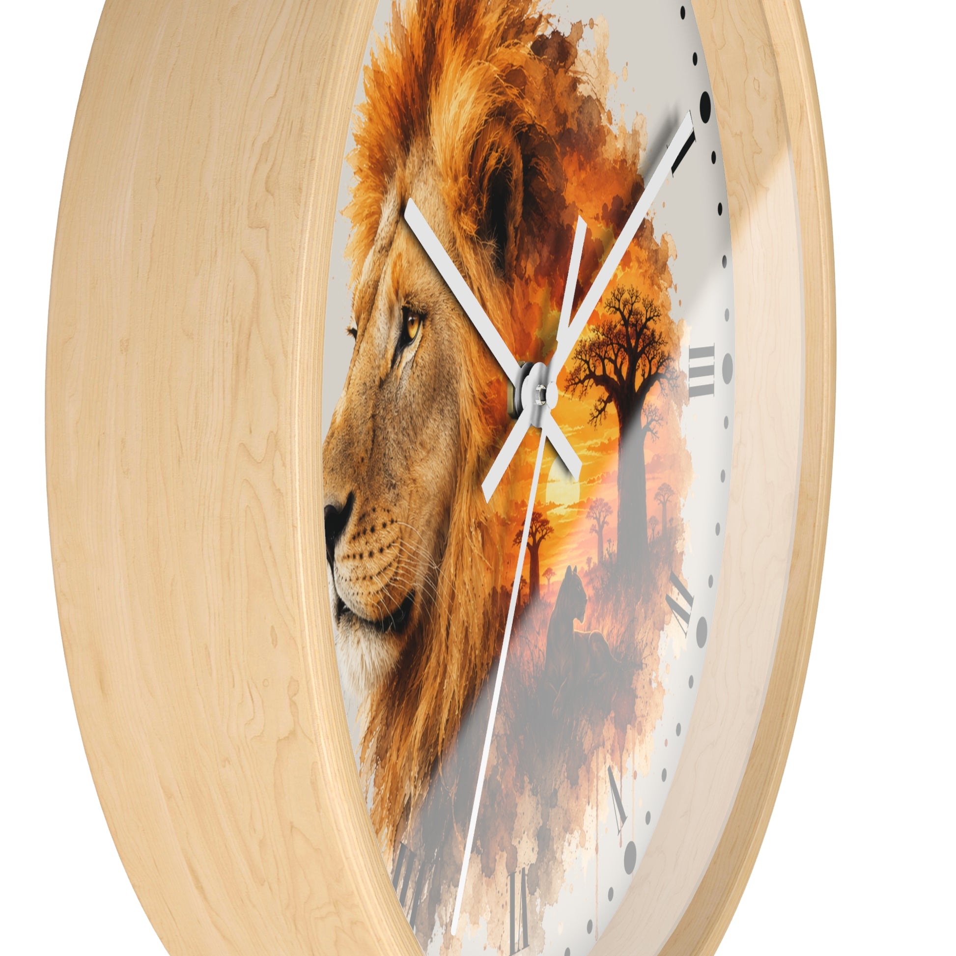 Round wall clock with a light natural wood frame and a printed face featuring a lion head in profile blending into an orange-toned landscape with tree silhouettes.