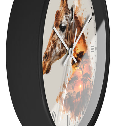 A close-up of a round wall clock with a black frame and a printed giraffe-and-sunset face design, shown against a plain white background.