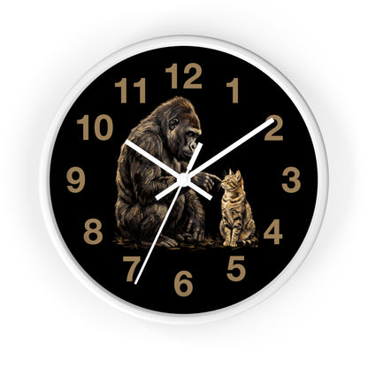 A round wall clock with a black face, white frame, gold Arabic numerals, and a detailed illustration of a gorilla and a cat on the front, shown against a plain white background.