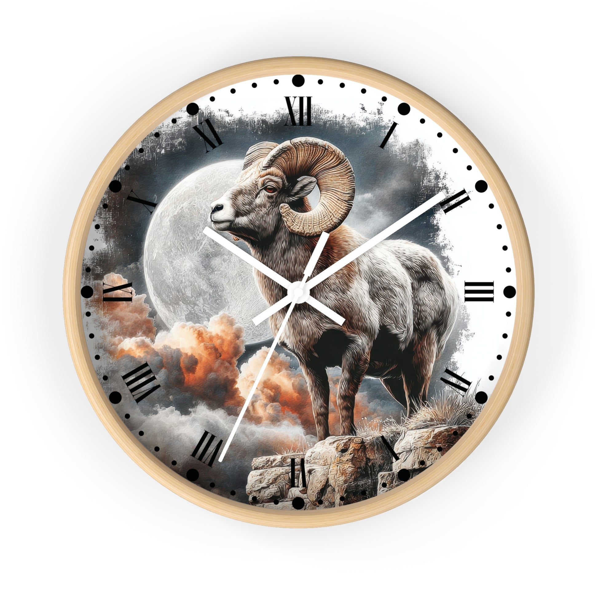 A round wall clock with a light wood frame and a printed design of a bighorn sheep standing before a large full moon and orange clouds. The clock face has black Roman numerals, black dot hour markers, and white hands, shown against a plain white background.