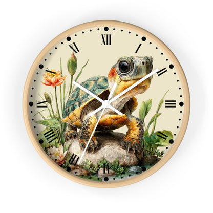 Round wall clock with a light wood frame and a detailed illustration of a turtle on the face, surrounded by flowers and greenery, with black Roman numerals and hands on a white background.