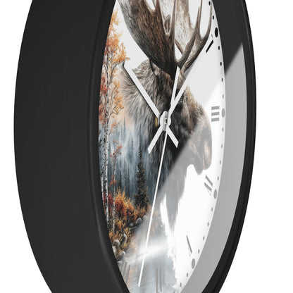 A close-up of a round wall clock with a black frame and a printed design featuring a moose head over a forest scene, with white clock hands and Roman numerals on a white dial.