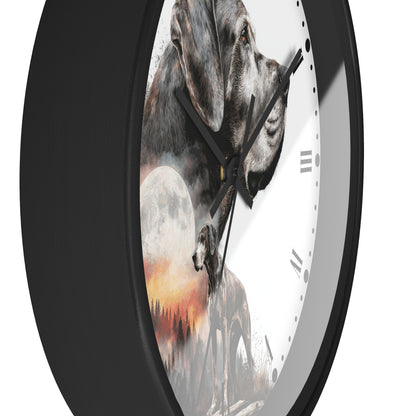 A round wall clock with a black frame and a white face featuring a composite dog portrait with a moon and sunset scene, shown on a white background.
