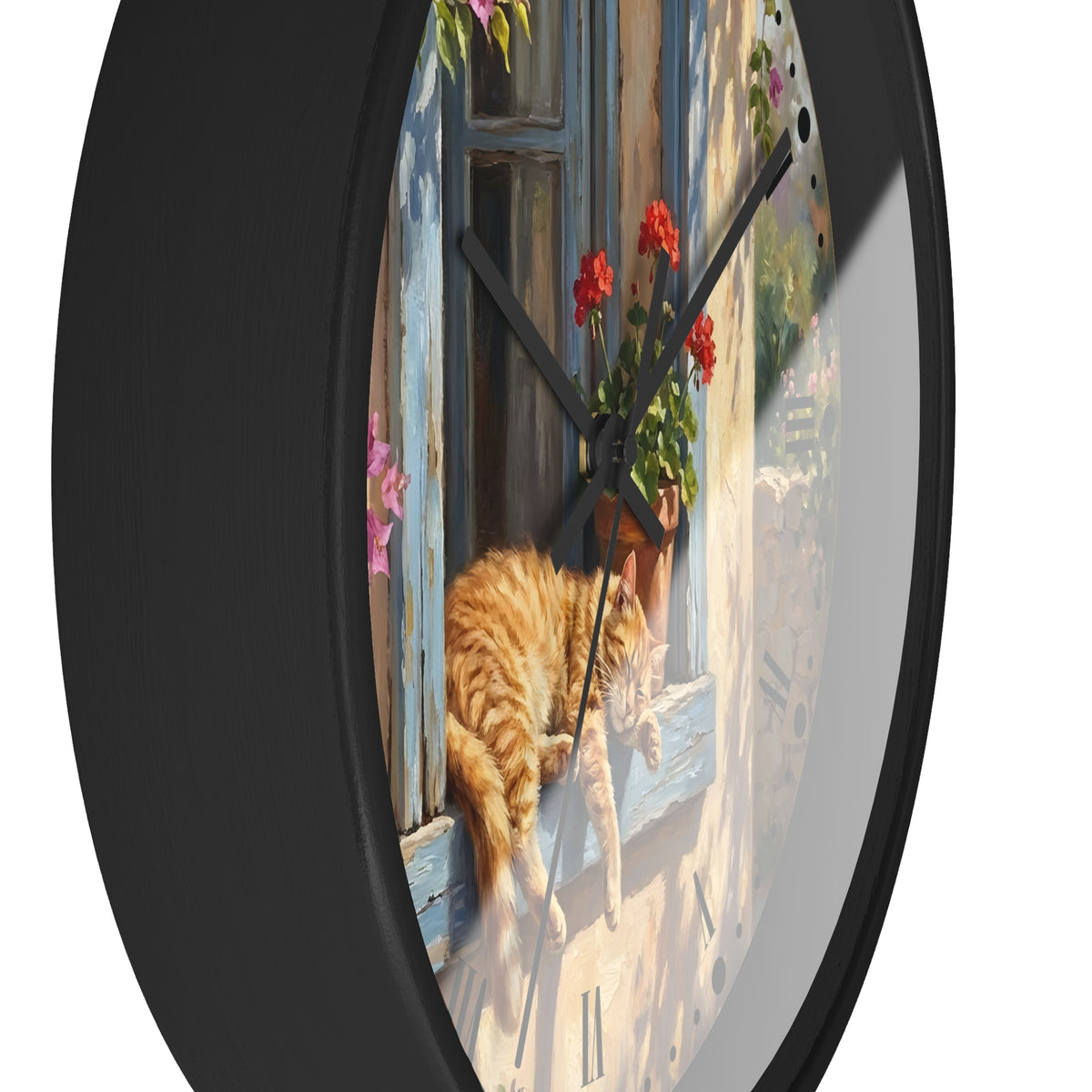 Round wall clock with a black frame and a printed illustration of an orange tabby cat lounging by a blue window with red flowers, shown against a white background.
