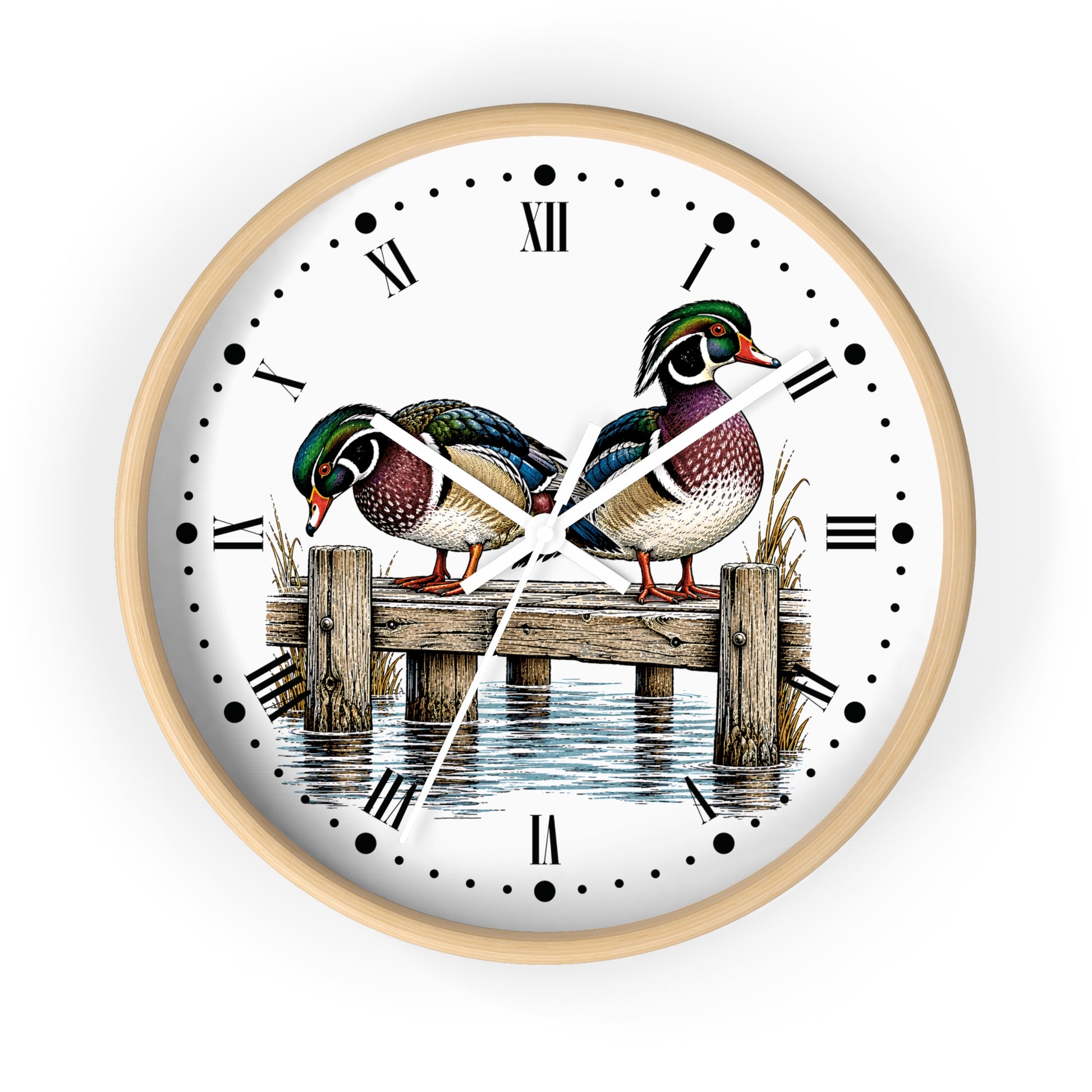 A round wall clock with a light natural wood frame and a white face featuring an illustration of two mallards on a wooden dock over water, with black Roman numerals and hands.