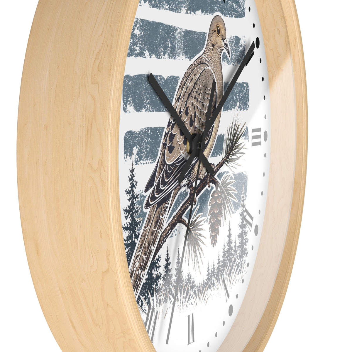 Round wall clock with a light natural wood frame and a white face featuring a detailed illustration of a brown dove  bird perched on a pine branch against a blue-and-white striped winter background.