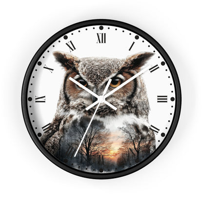 Round wall clock with a black frame and a printed owl design over a forest sunset scene on a white dial with Roman numerals and black hour markers.