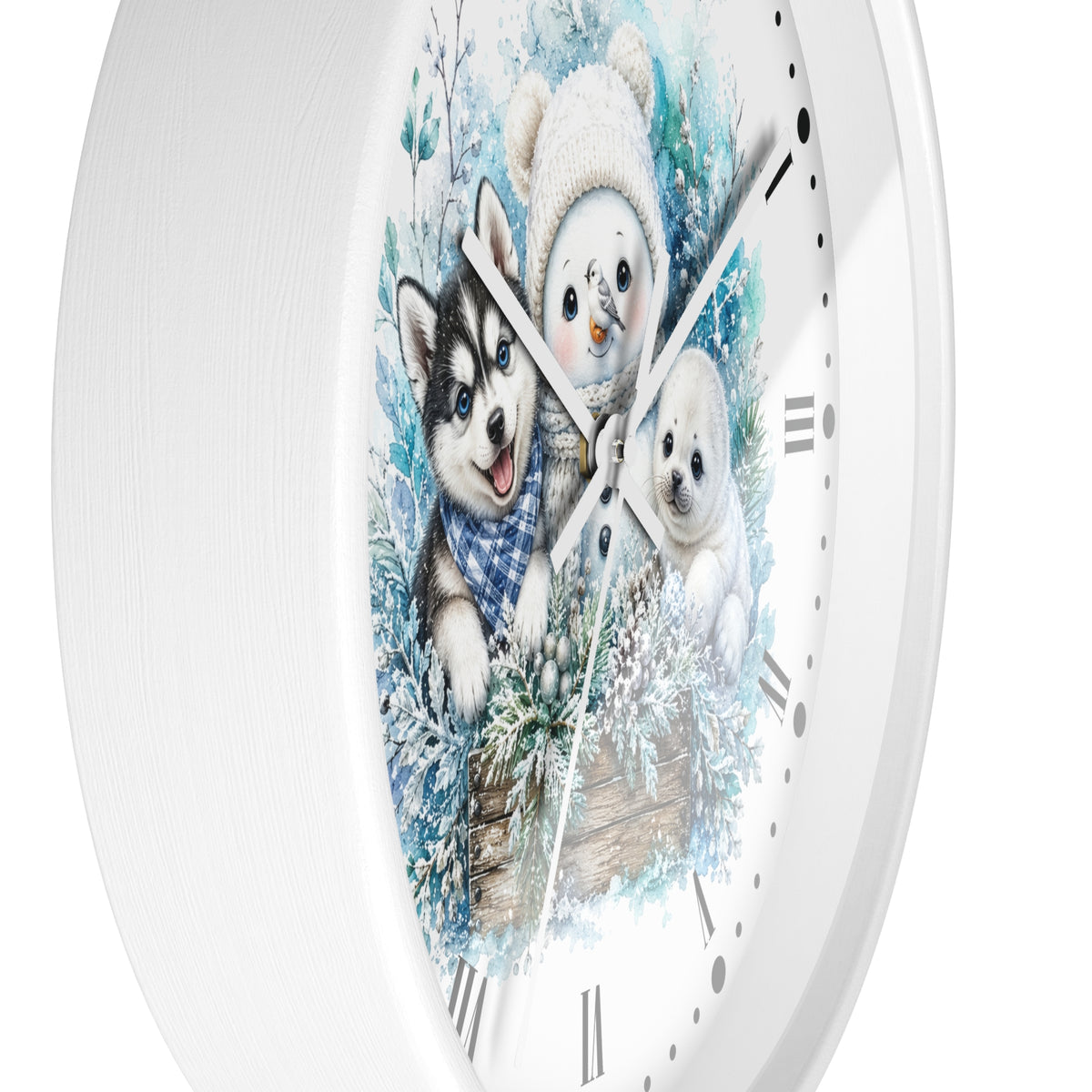 A white round wall clock with a winter illustration of three puppies on the face, featuring silver-tone hands and black Roman numerals, shown against a plain white background.