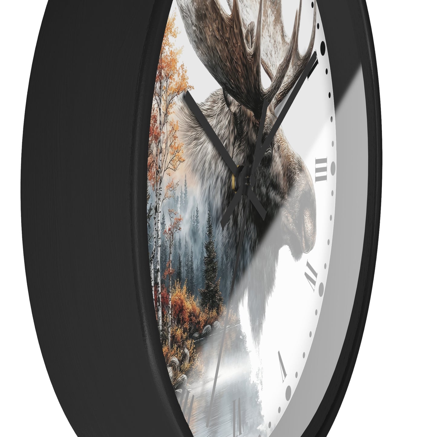 A close-up of a round wall clock with a black frame and a white face featuring a moose head over a forest scene with autumn trees.