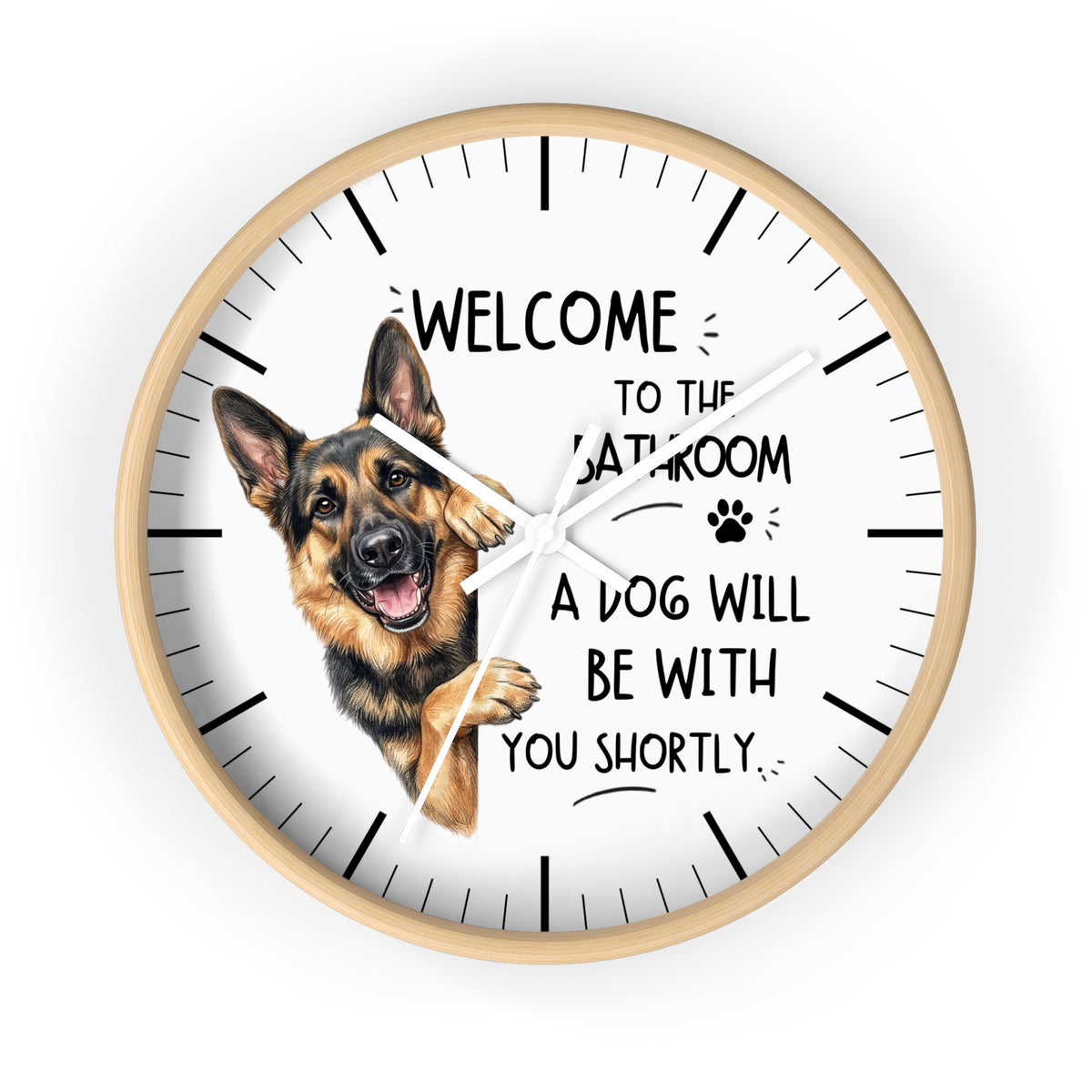 A round wall clock with a light wood frame and a white face, featuring a German Shepherd illustration and the text 'WELCOME TO THE BATHROOM A DOG WILL BE WITH YOU SHORTLY.' on a plain white background.