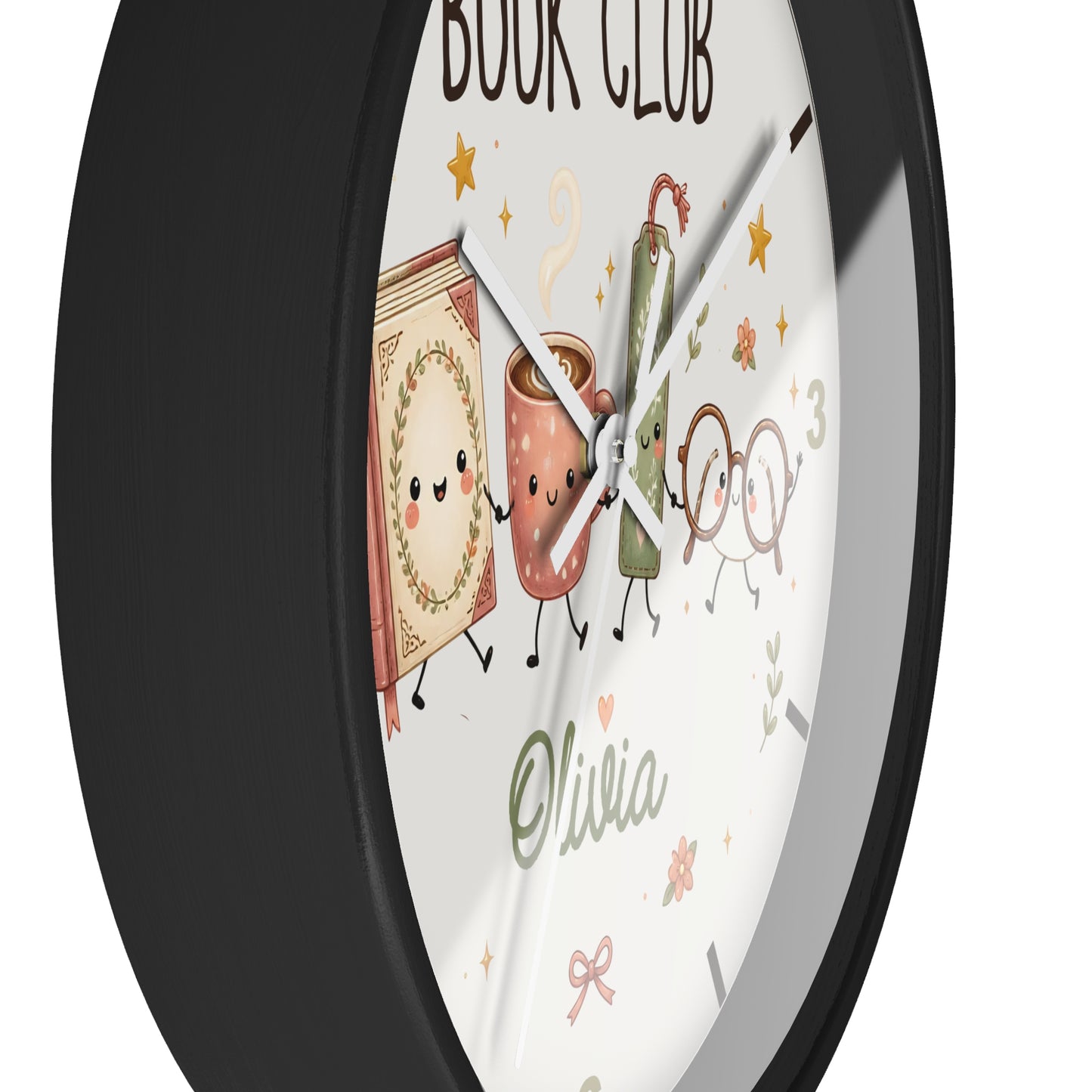 A round wall clock with a black frame and a white face featuring a cute book-and-coffee-club illustration, gold stars, the words 'BOOK CLUB' at the top, and the name 'Olivia' near the bottom.
