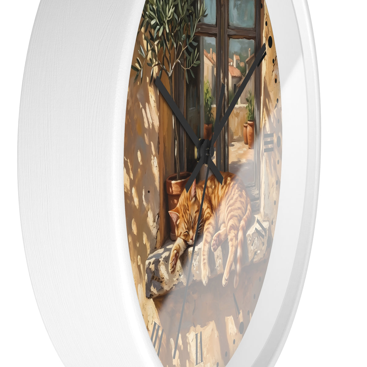 Oval wall clock with a white frame and a printed scene of an orange tabby cat lying on a sunlit balcony, shown against a plain white background.