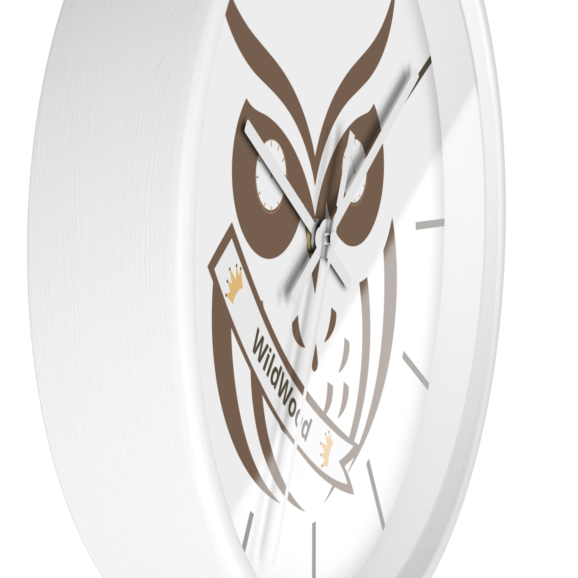 A close-up of a round white wall clock featuring a brown owl graphic and a banner that reads 'WildWorld'.