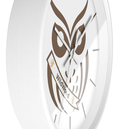 A close-up of a round white wall clock featuring a brown owl graphic and a banner that reads 'WildWorld'.
