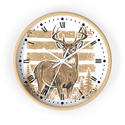 A round wall clock with a light wood frame, featuring a white face printed with a brown deer illustration, tan horizontal stripes, black Roman numerals, and white hands.