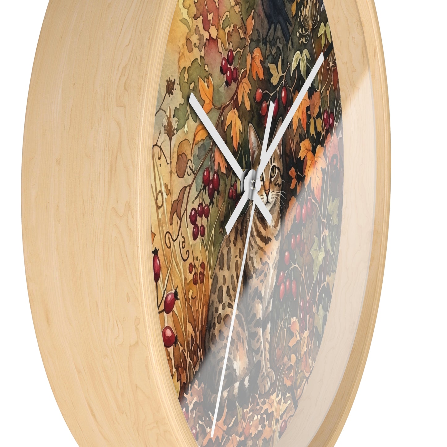 Round wall clock with a light natural wood frame and a printed autumn scene featuring a cat, leaves, berries, and a cat on the clock face, shown against a plain white background.