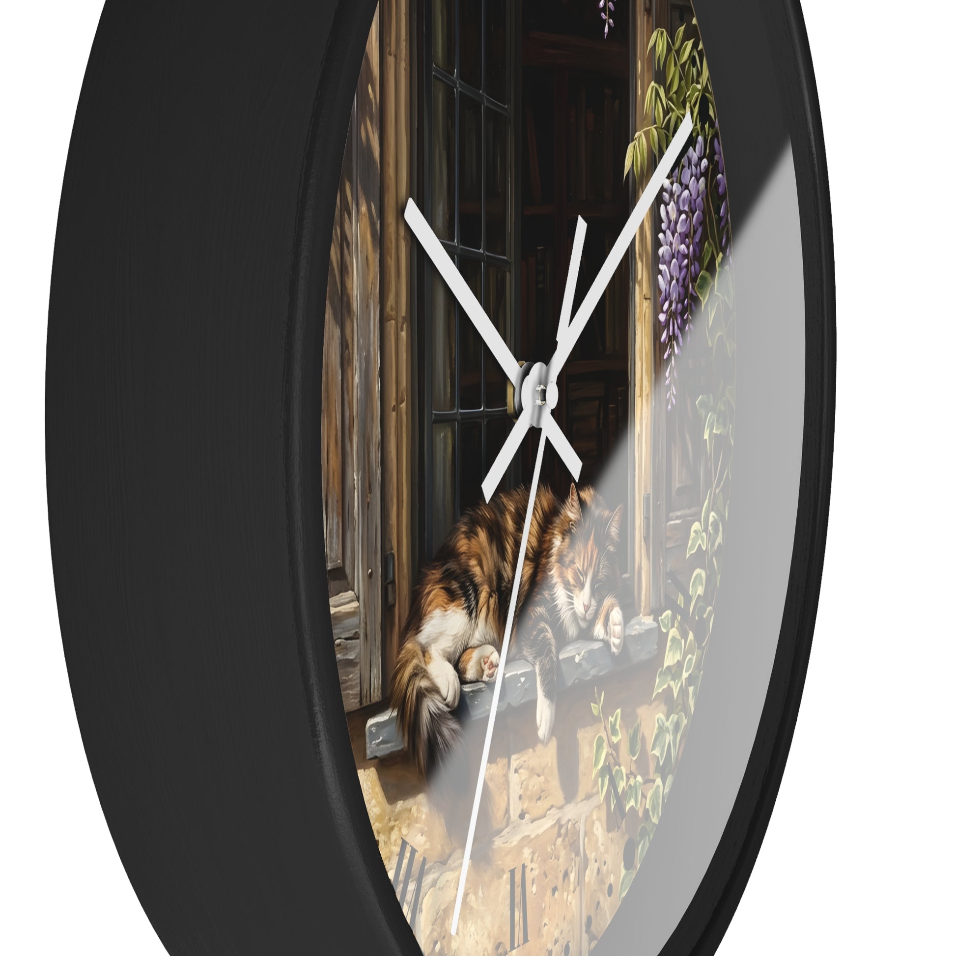 A round wall clock with a black frame and a printed scenic design featuring a calico cat by a window, white clock hands, and a clear glass face.
