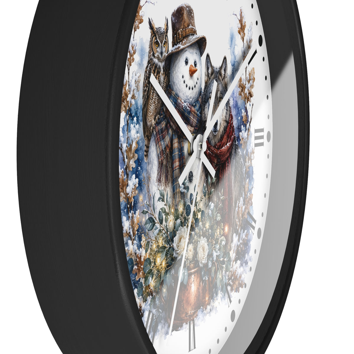 A close-up of a round wall clock with a black frame and a white face featuring a winter illustration of a snowman wearing a brown top hat and plaid scarf, flanked by two cats, with snowy foliage in the background.