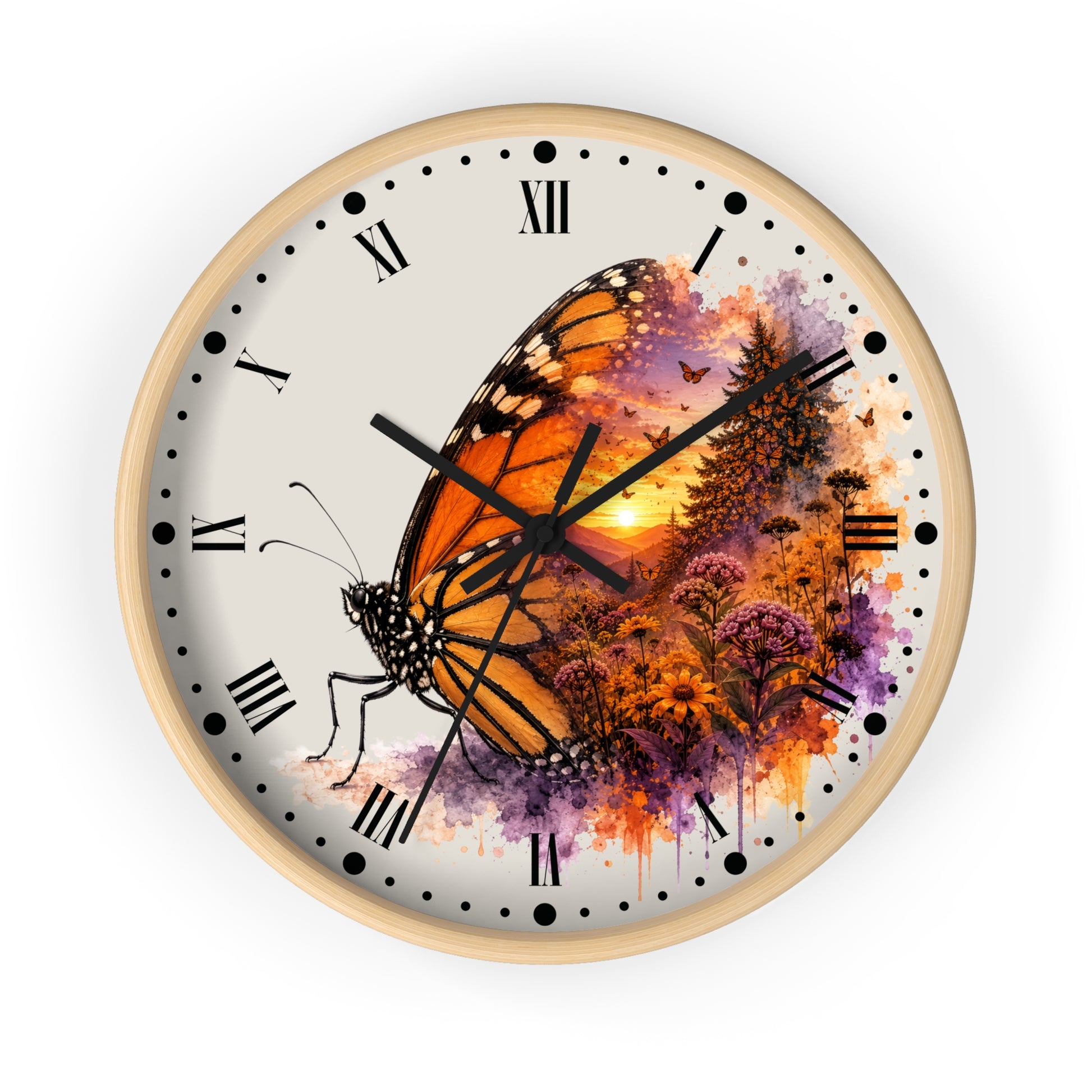 Round wall clock with a light wood frame and a printed butterfly artwork. The clock face is off-white with black Roman numerals and markers, and the central design shows a large orange-and-black butterfly over a sunset landscape with purple and orange floral watercolor details.