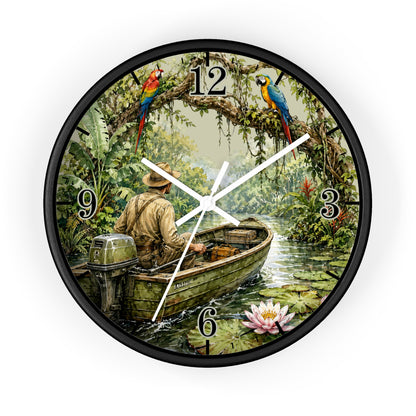 Round wall clock with a black frame and a tropical jungle scene printed on the face, showing a man rowing a boat on a river with colorful parrots at the 12 and 3 positions.
