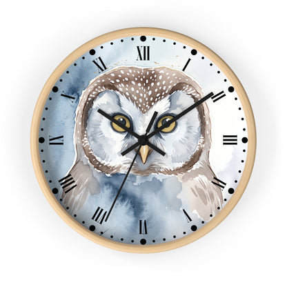 Round wall clock with a light wood frame and a watercolor-style owl illustration on the face, with black Roman numerals and hands on a white background.