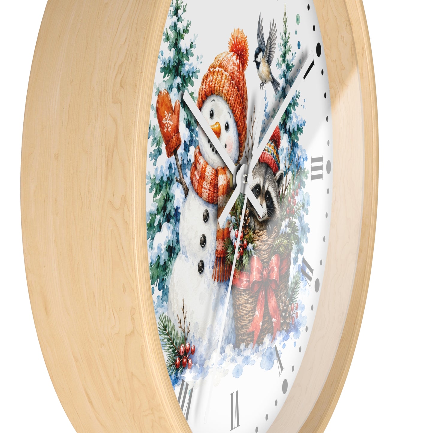 Round wall clock with a light natural wood frame and a white face featuring a winter holiday illustration of a snowman, bird, and evergreen trees.