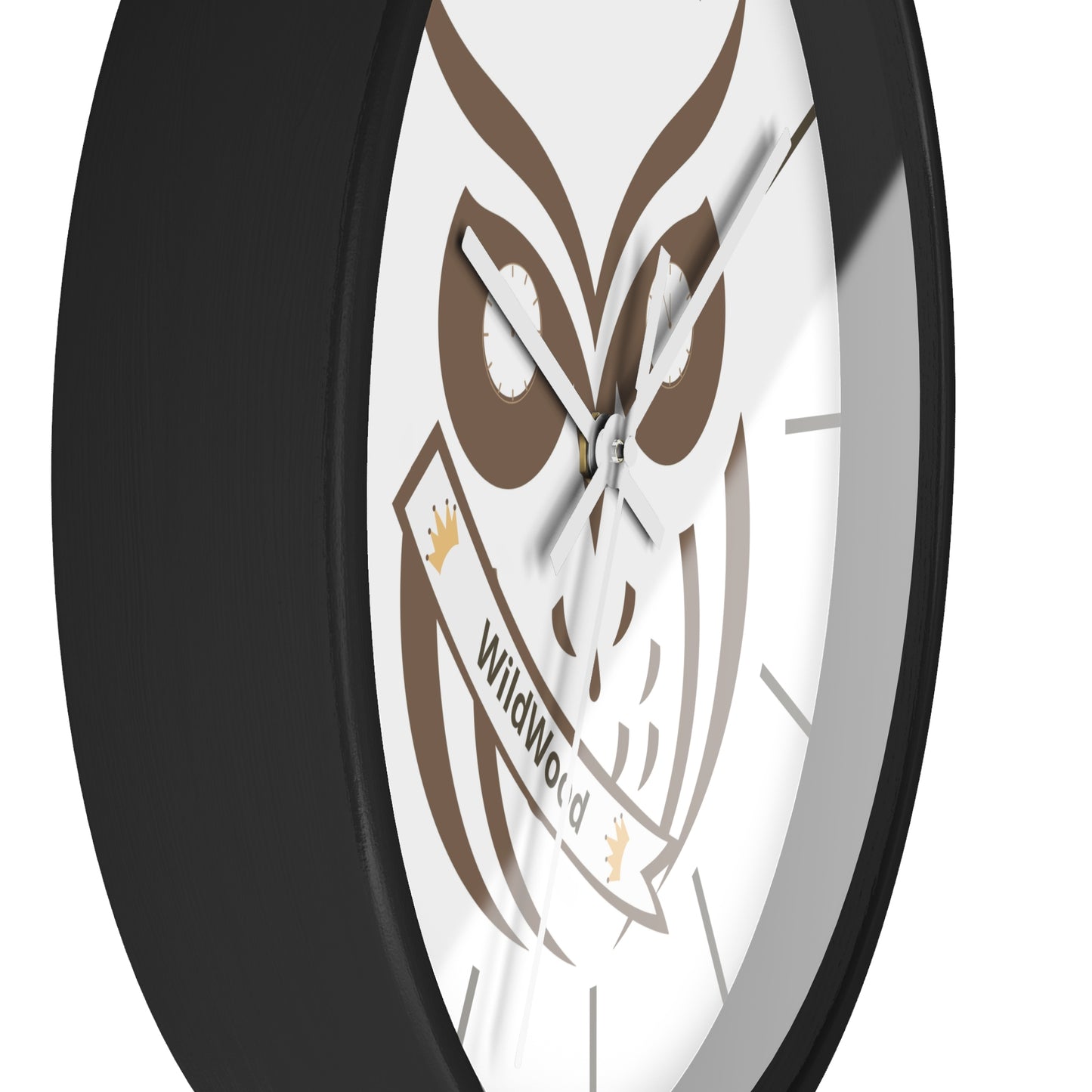 A close-up of a round wall clock with a black frame and a white face featuring a brown owl graphic and a banner that reads 'WildWorld'.