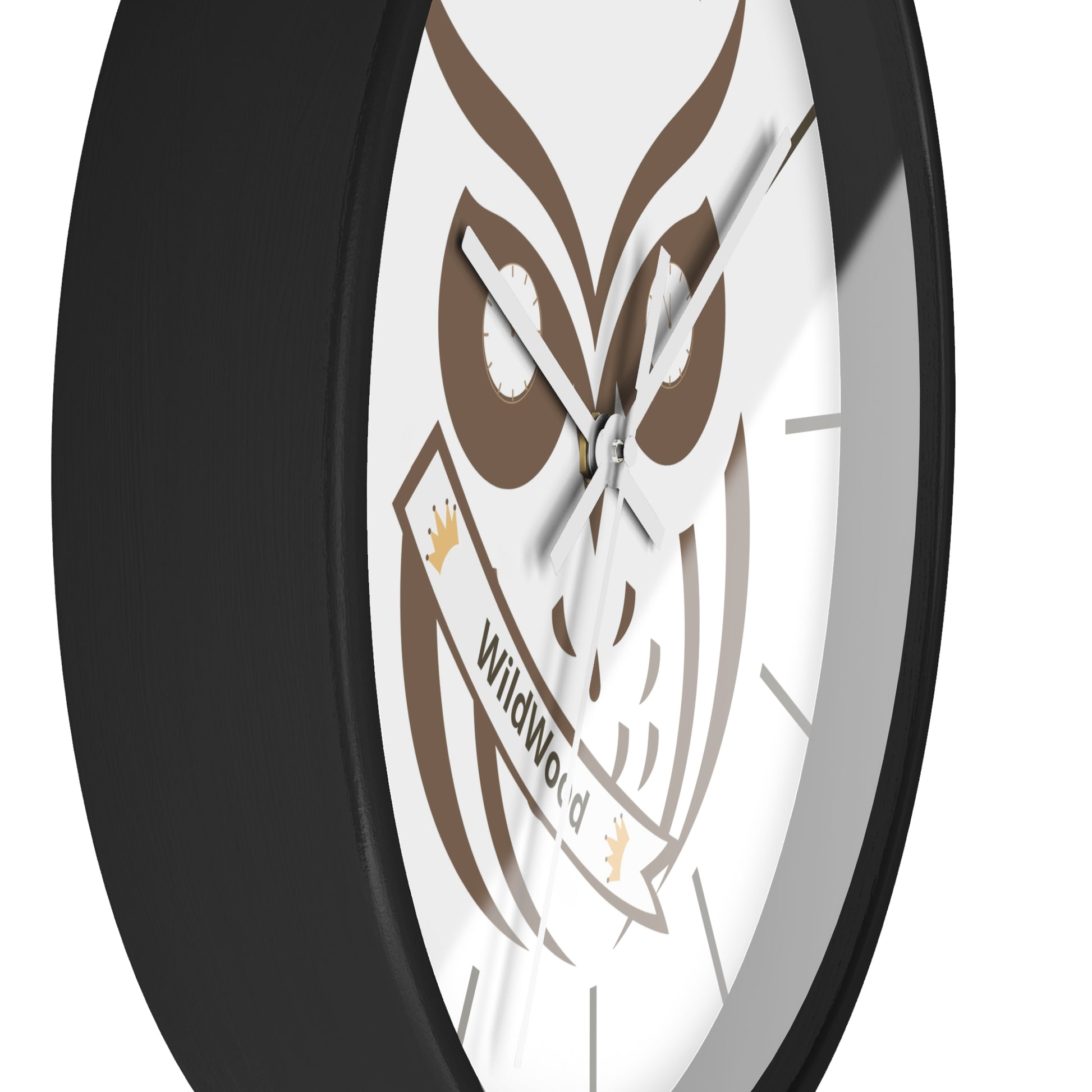 A close-up of a round wall clock with a black frame and a white face featuring a brown owl graphic and a banner that reads 'WildWorld'.