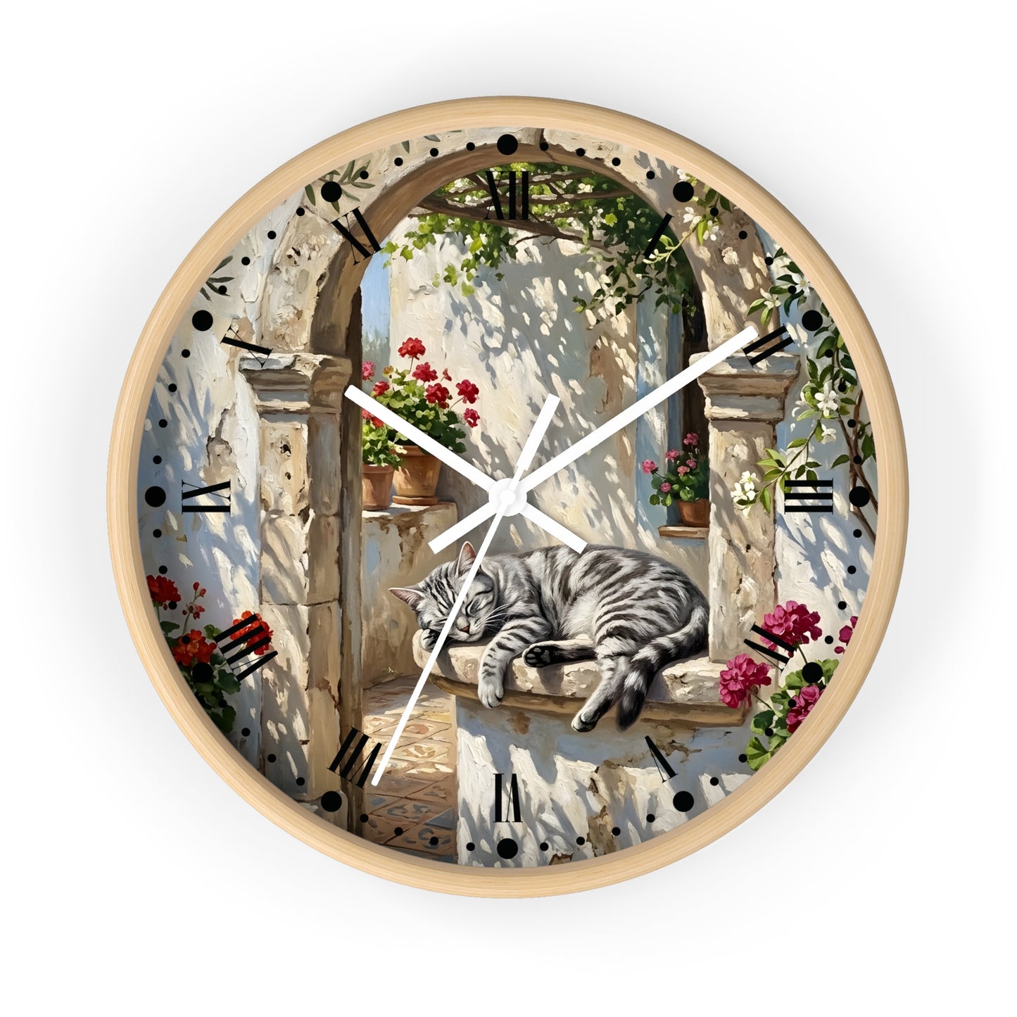 Round wall clock with a light wood frame and a printed scenic dial showing a gray tabby cat resting on a stone ledge beneath an arched window with flowers and shadows.