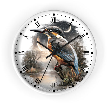 A round wall clock with a white frame and a printed nature scene on the face, featuring a kingfisher perched over water at dusk with a moon and stars in the background. The clock has black Roman numerals, black hour markers, and black hands.