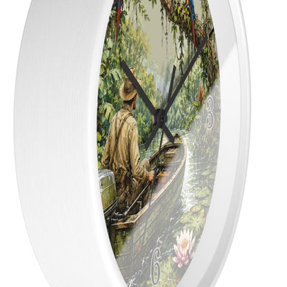 Round wall clock with a white frame and a printed scenic dial showing a man in a boat on a river surrounded by lush greenery. The clock hands are black, and the number 6 is visible near the bottom right of the dial.