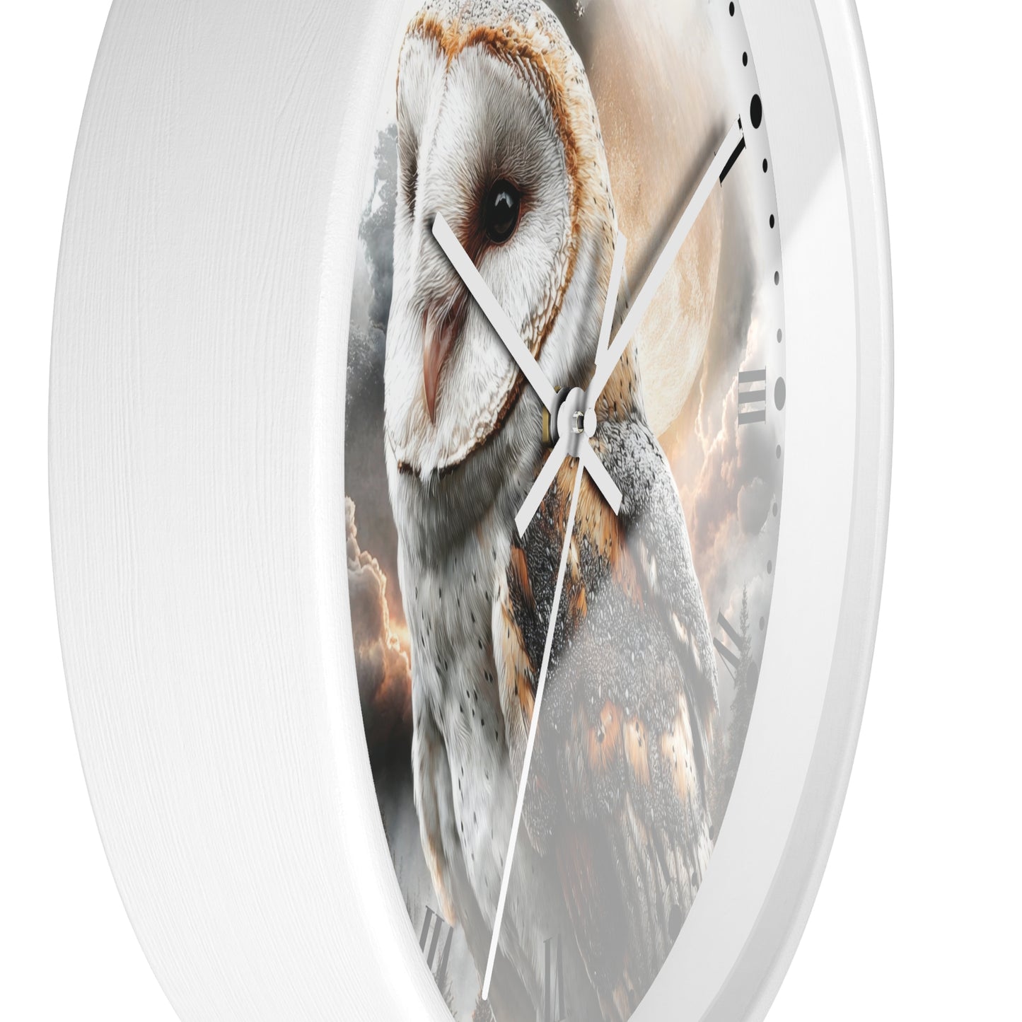 Round wall clock with a white frame and a printed owl face and feathers across the face, with white hands and black minute markers on a white background.