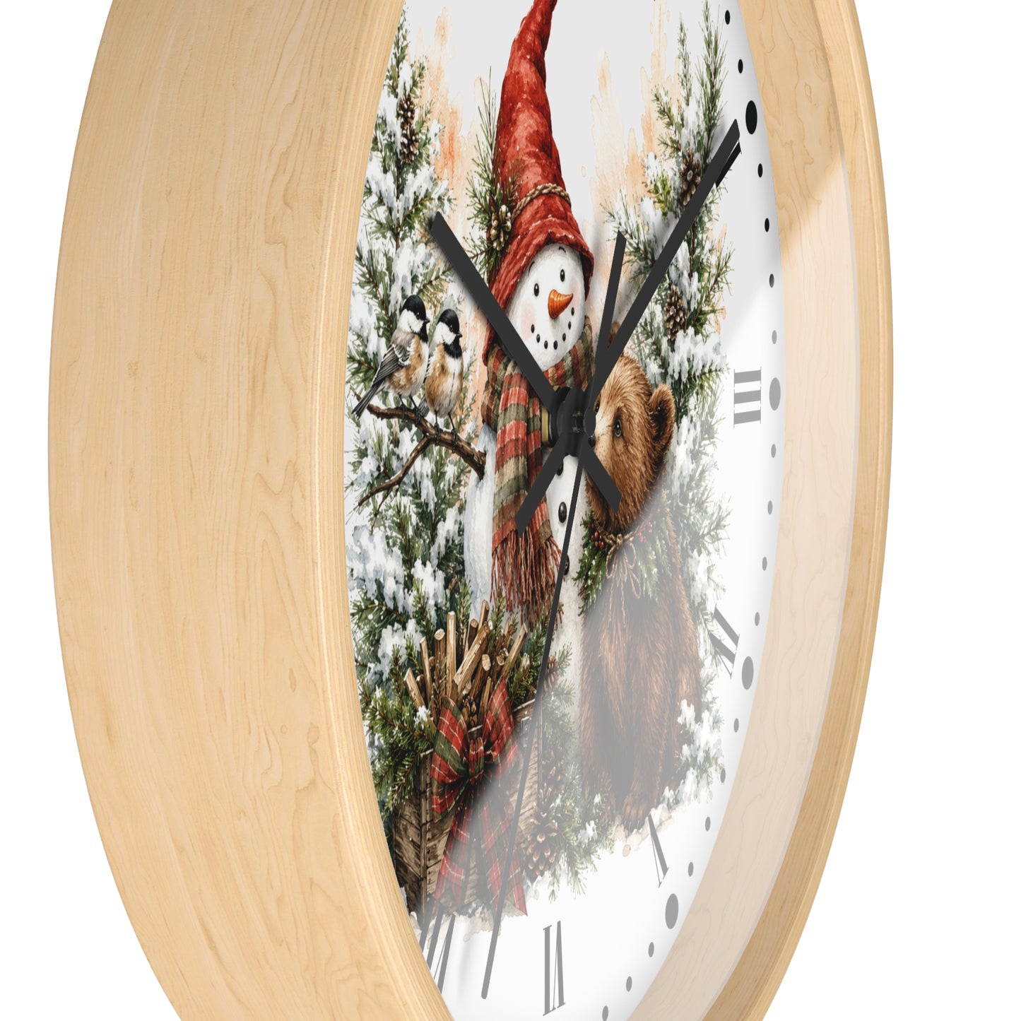 Round wall clock with a light natural wood frame and a festive printed dial showing a snowman in a red hat among evergreen branches and a brown bear, on a white background.