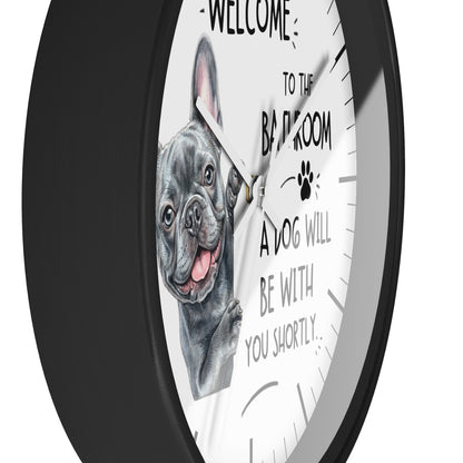 A round wall clock with a black frame and a white face featuring a French bulldog illustration and the text 'WELCOME TO THE BAR ROOM A DOG WILL BE WITH YOU SHORTLY.