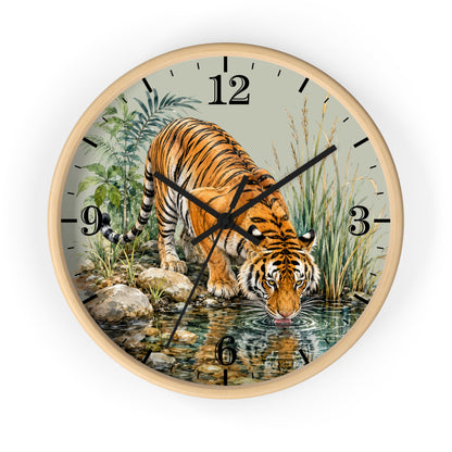 Round wall clock with a light wood frame and a printed illustration of a tiger drinking water from a stream, with black Arabic numerals and clock hands on a white background.