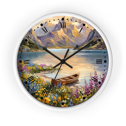 A round wall clock with a white frame and a scenic landscape print featuring mountains, a lake, wildflowers, and a canoe. The clock face has black Roman numerals and black hands on a white background.