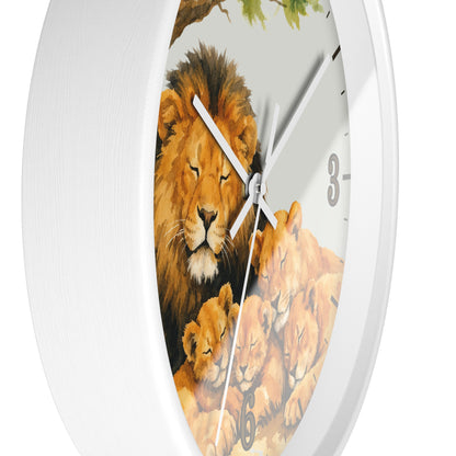 A white round wall clock featuring a detailed illustration of a lion and lion cub family on the face, with white hands and black Arabic numerals.