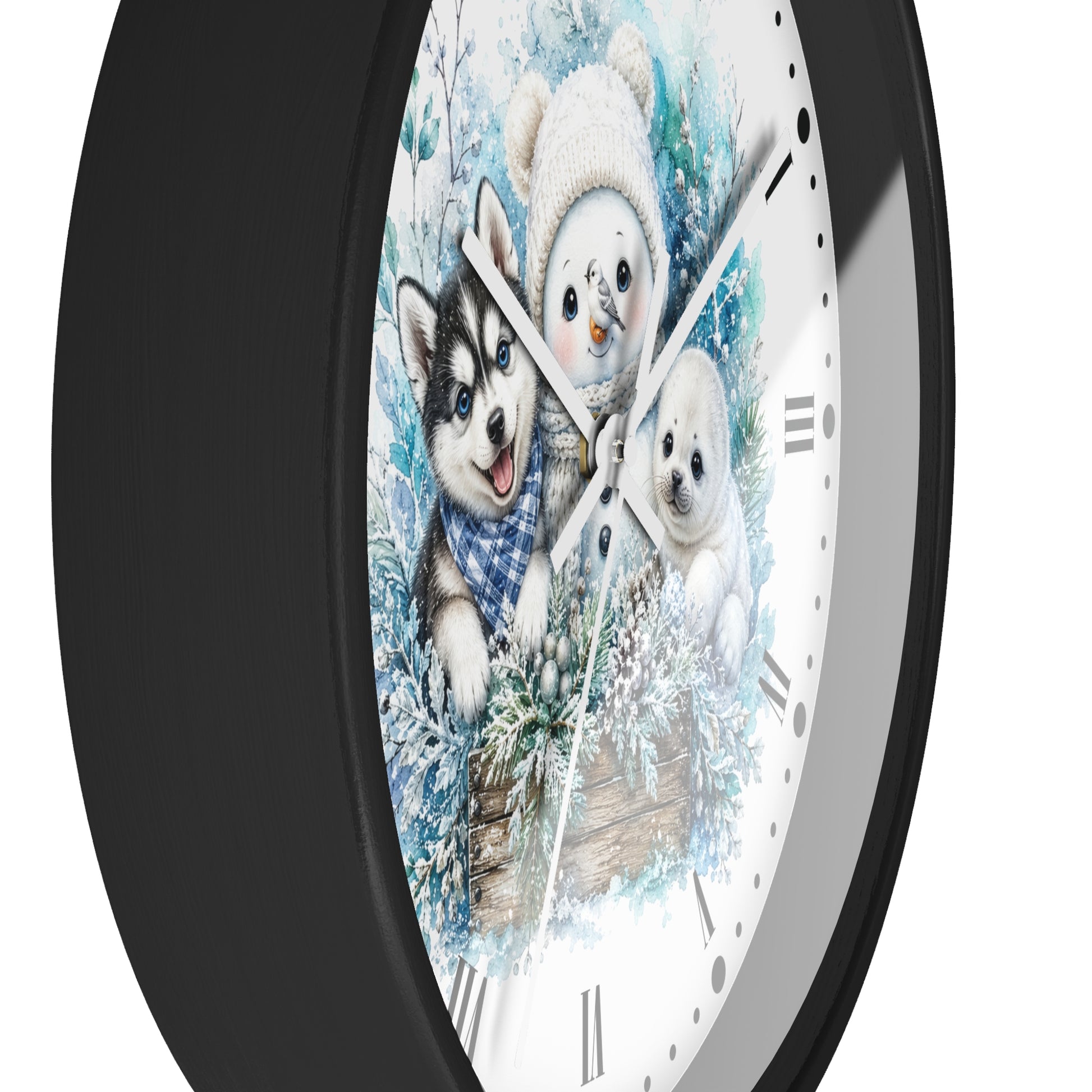 A round wall clock with a black frame and a white face featuring a winter illustration of a husky, a snowman, and a puppy in blue and white tones.