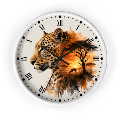 A round wall clock with a white frame and Roman numerals, featuring a printed design of a leopard blending into an African savanna sunset scene with trees and a bird.
