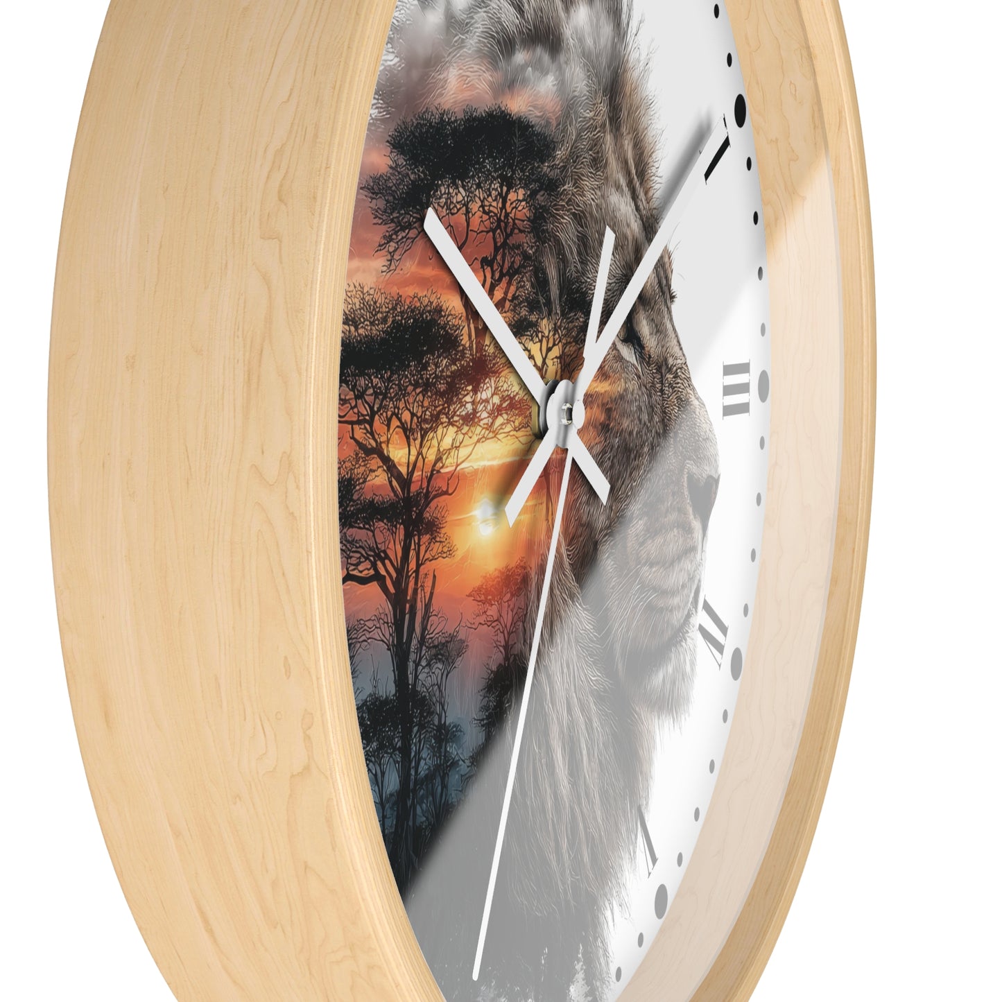 Round wall clock with a light natural wood frame and a split design on the face showing a lion face over an African savanna sunset scene, on a white background.
