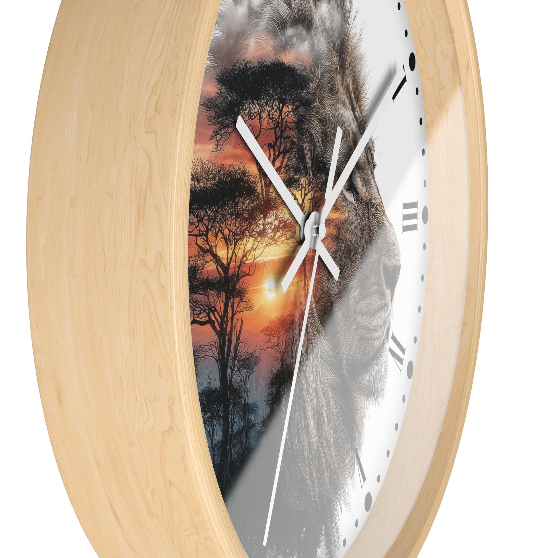 Round wall clock with a light natural wood frame and a split design on the face showing a lion face over an African savanna sunset scene, on a white background.